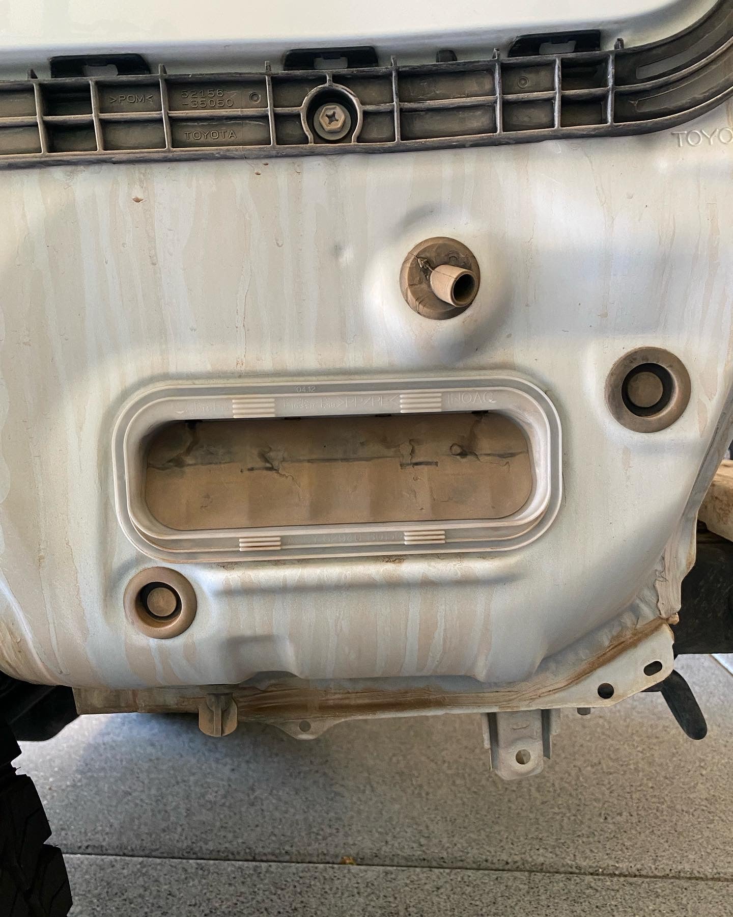 OEM vent located behind bumper, notice the rubber flaps. they are the main access point of dust, dirt debris, and even mice. It opens right into the cabin and collects behind interior panels and pollutes the cabin.